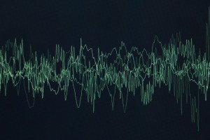 sound or audio waves oscillating on black background